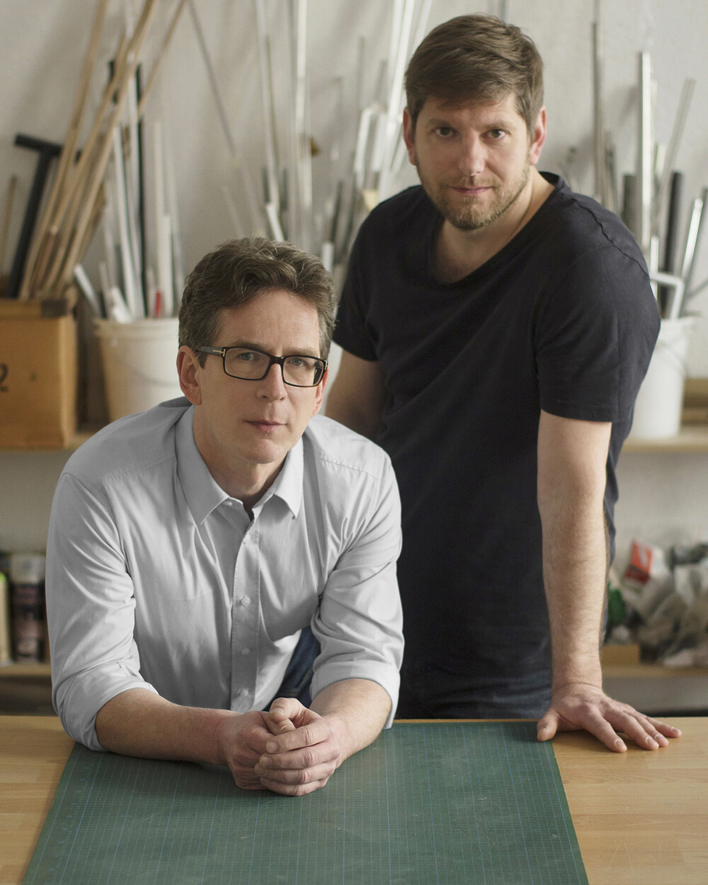 Portrait of the designers Hauke Murken and Sven Hansen in their Berlin studio – photographed for Faust at a work table with workshop character.