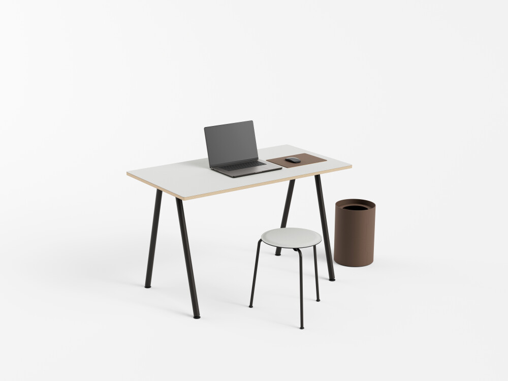 DIN PLUS desk by Faust with light brown linoleum and round black frame, with laptop, mouse and tidy bin.