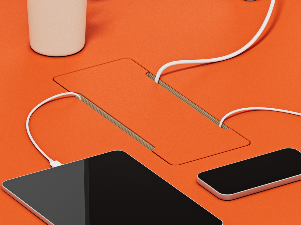 Rectangular linoleum cable cover embedded in linoleum table top.