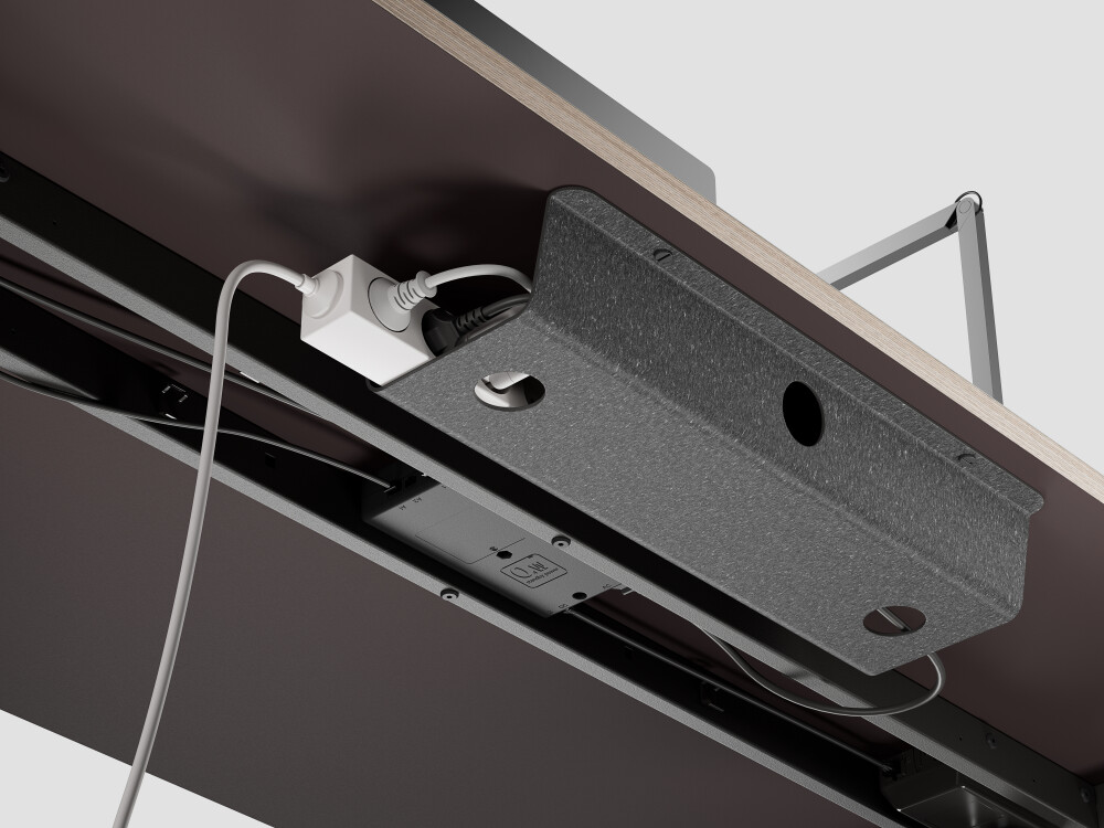 Mounted LINO cable tray from Faust under desk top - linoleum inside, Lefa outside, with power strip and cables, design: Daniel Lorch.