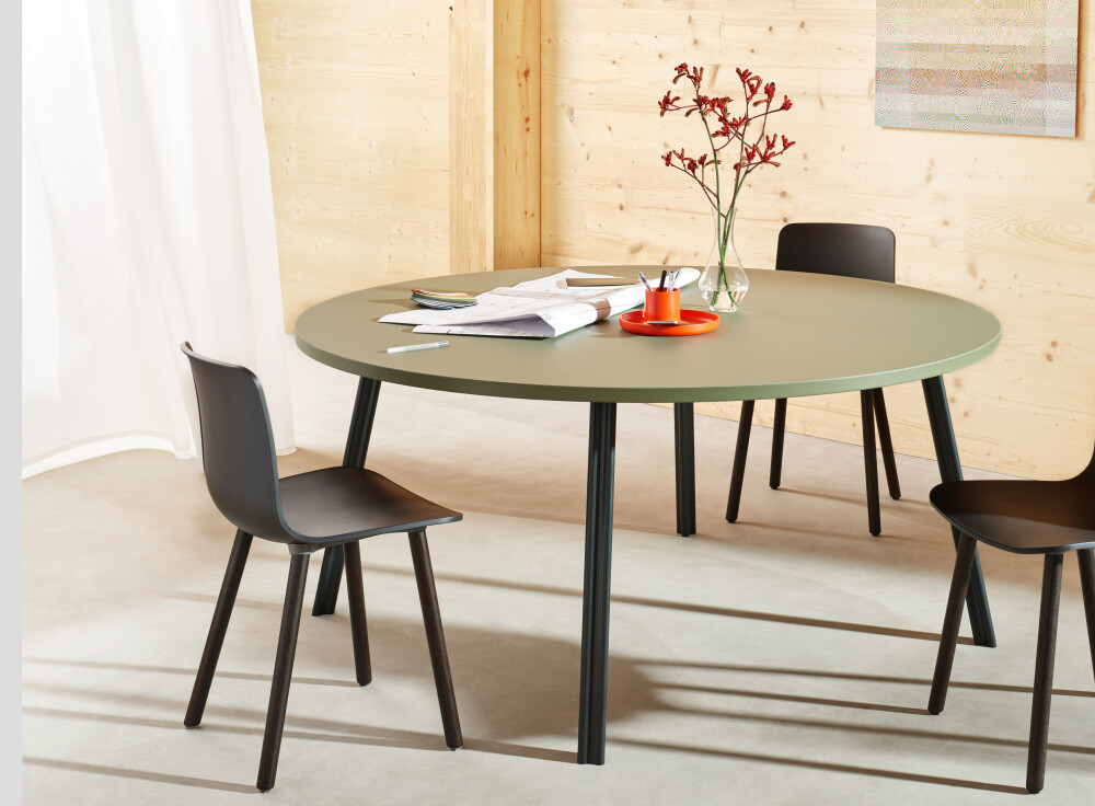 Round meeting tabletop lined in olive green linoleum with coloured edge mounted on DIN aluminium legs by Michel Charlot for FAUST Linoleum