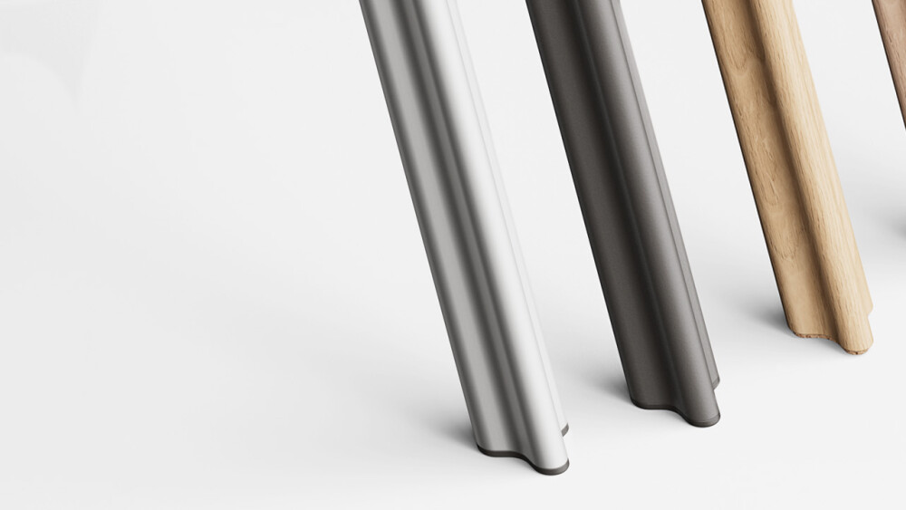 Eine Abfolge von vier BEAM-Beinen, auf einem weißen Hintergrund, von Vordergrund bis Hintergrund: BEAM-Bein in mattem silber eloxiertem Aluminium mit Kunststoffgleitern; BEAM-Bein in schwarz pulverbeschichtetem Aluminium mit Kunststoffgleitern; BEAM-Bein