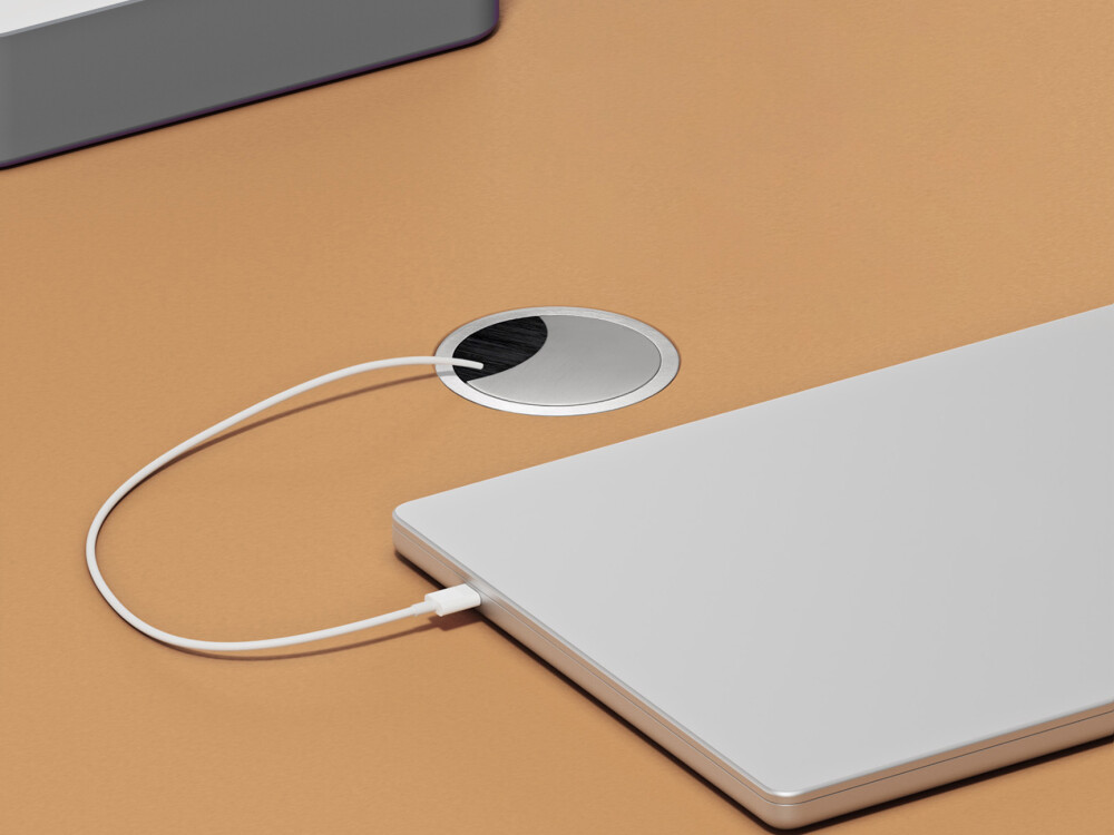 Round cable aperture from Faust with removable aluminum cover and brush insert, flush-mounted in linoleum panel.