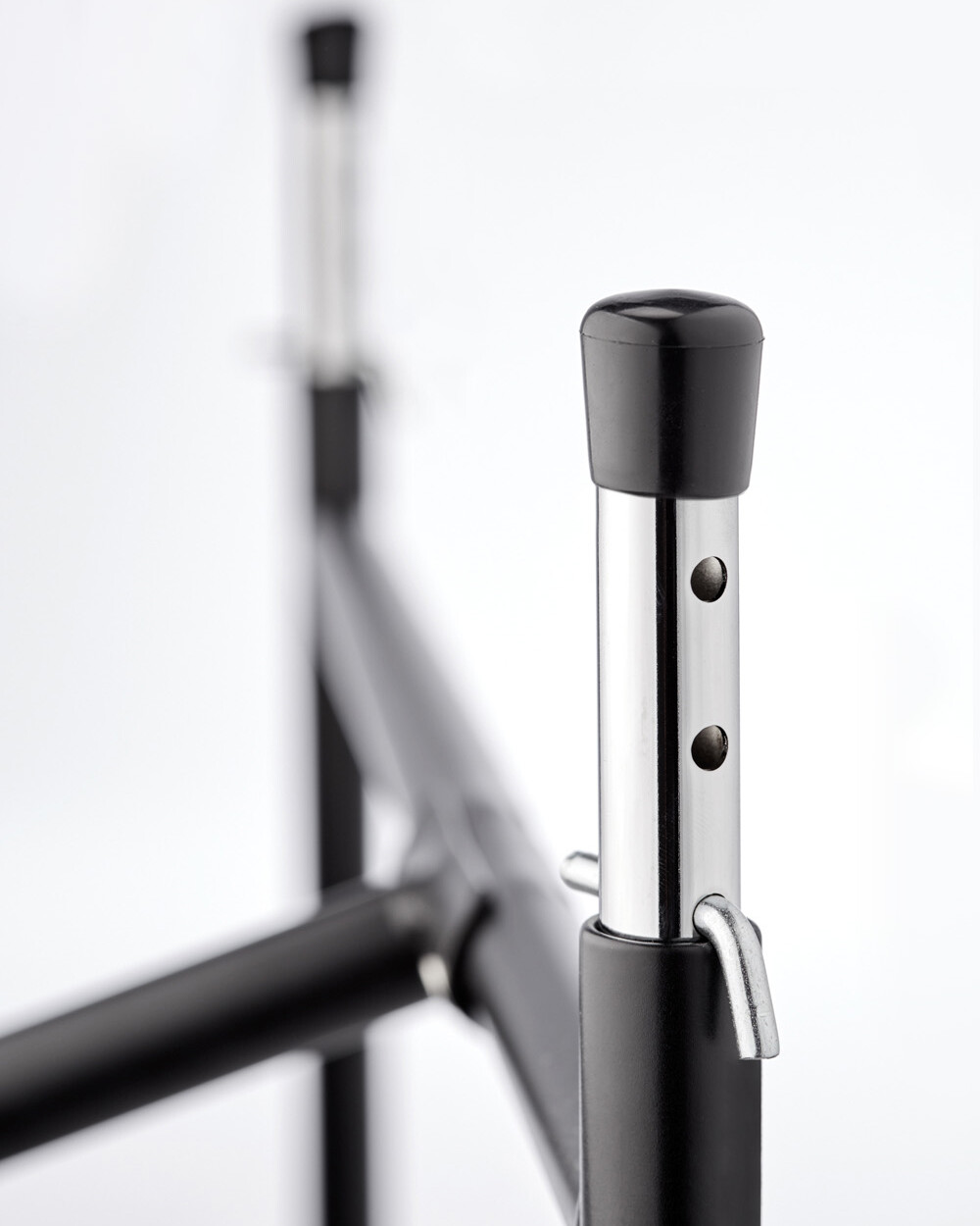 Detailed view of the short height adjuster (4 holes) with table leg caps for the E2 table frame.