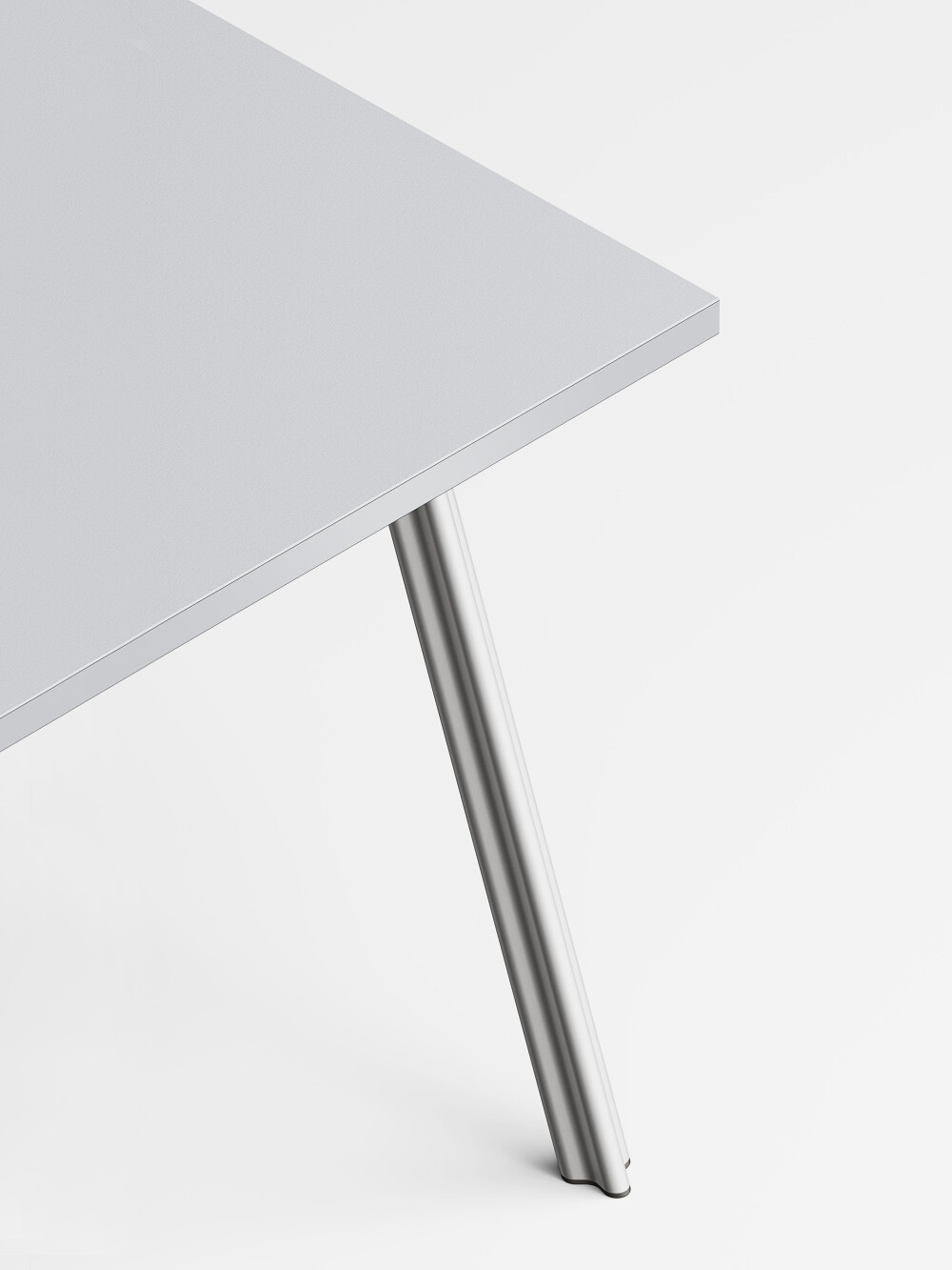 Detail of the aluminum matt Beam table leg on a light grey linoleum tabletop.