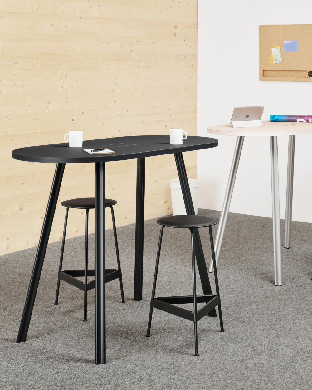 Beam standing tables in the office, suitable for short discussions and meetings in open spaces, with Ravioli stools and pinboard.