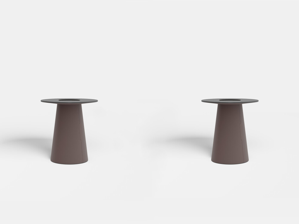 Dark brown linoleum cone feet of the ALT table in a freestanding view.