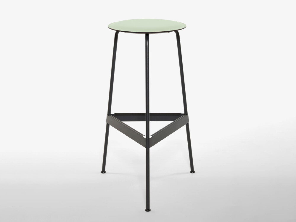 RAVIOLI bar stool with linoleum seat in pistachio and black steel frame, photographed in front of a neutral background in the studio.